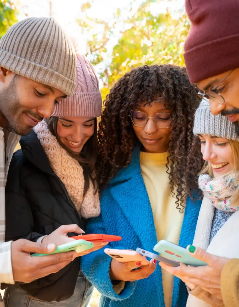 Group of people using phones to share affiliate links